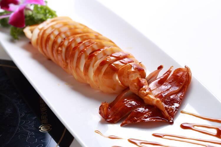 Squid · Tender grilled squid topped with chef's special sauce.