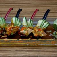 Sexy Jalapeno · Cold. Jalapeno peppers stuffed with spicy tuna, cream cheese and fried crispy. Served with e...