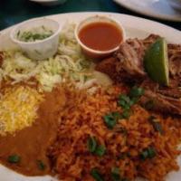 Pork Carnitas Special · Slow roasted lightly seasoned pork. served with refried beans and Mexican rice, red chili sa...