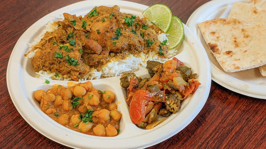 Curry Chicken Platter · Tender chicken in a mildly spiced curry. Served over basmati rice. Comes with your choice of 2 sides and a pita.