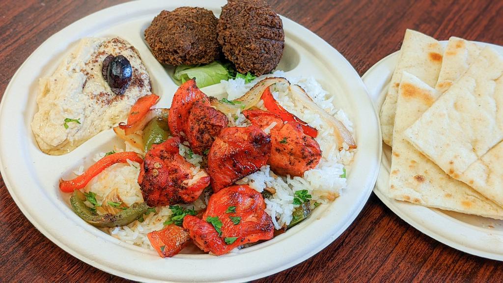 Kabob Platter with Rice · Chicken kabob skewer with basmati rice and your choice of 2 sides. Served with pita.