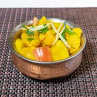75. Aloo Gobi · Potato and cauliflower seasoned with spices, garlic and ginger.