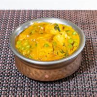 80. Matar Paneer · Home style Indian cheese and green peas cooked in a creamy sauce.