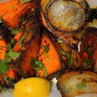 67. Paneer Tikka · Chunks of paneer marinated in spices and grilled in a tandoori oven.