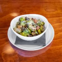 Brussels Sprouts  · Roasted brussels sprouts, pork belly, roasted garlic, pecorino, lemon zest, and olive oil.