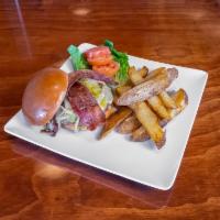 Green Chile Burger  · 1/2 Pound brisket burger, white cheddar cheese, bacon, lettuce, tomato, caramelized onions, ...
