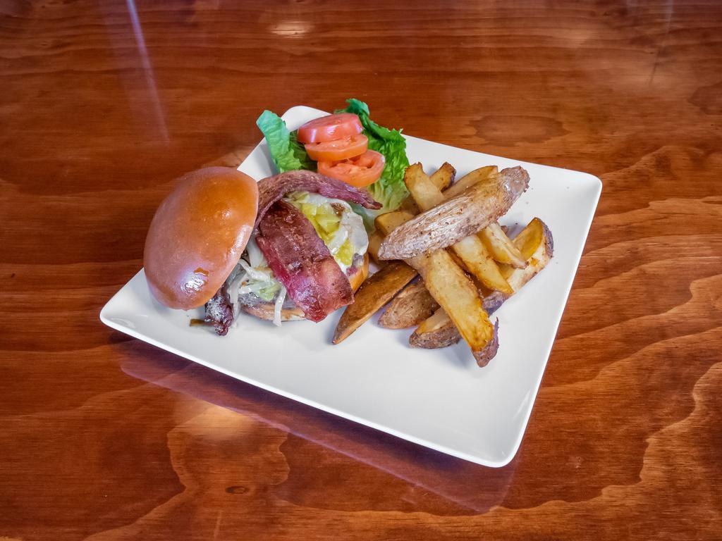 Green Chile Burger  · 1/2 Pound brisket burger, white cheddar cheese, bacon, lettuce, tomato, caramelized onions, green chilies, brioche bun, handcut fries with truffle aoili.