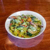 Pappardelle Pesto  · Pappardelle pasta, shrimp, zucchini, charred heirloom tomatoes, and pesto sauce.