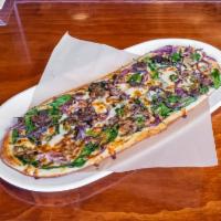Trust Us · House white sauce, four cheese blend, caramelized red onion, mushrooms, and spinach.