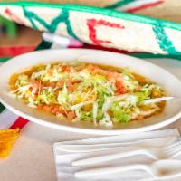 Smothered Burrito Lunch · Green chile, choice of meat, beans, tomatoes, lettuce, cheese, and sour cream.
