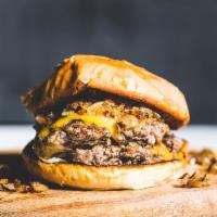 Flat Top · Served on brioche, two 4oz. certified Angus beef patties, cheddar, white American cheese, gr...