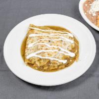 Enchiladas Suizas · Com tortillas with your choice of filling topped with melted cheese, sour cream and spicy gr...