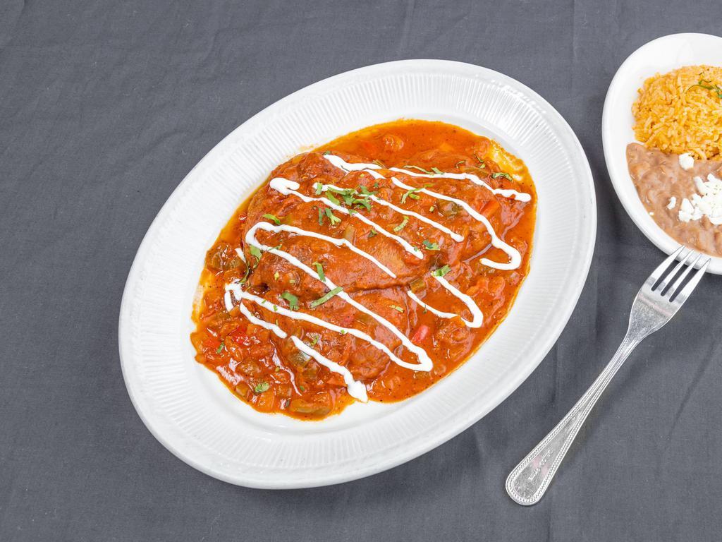 Chile Relleno Dinner · The season's premium poblano peppers stuffed with cheese. Topped with zesty tomato sauce and sour cream. Served with rice and beans. 