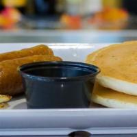 Buttermilk Pancakes · 2 golden brown pancakes, served with 2 eggs and your choice of bacon or sausage links.