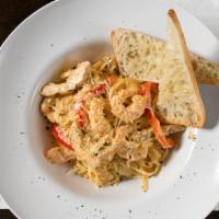 Cajun Chicken and Shrimp Pasta · Sauteed chicken, shrimp and red bell peppers, tossed with fettuccine in a spicy Cajun Alfred...