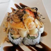Baked Scallop Dynamite Roll  · In: crab mix cucumber and avocado. Top: bay scallop, smelt roe, crab mix, mushroom and and o...