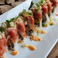 Volcano Roll · Shrimp Tempura top with Spicy Tuna, Sweet Chili Sauce, Fried Onions, Crunchy and Scallion