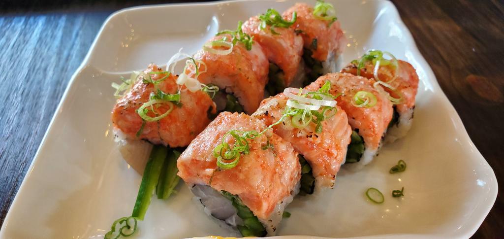 Crazy Yellowtail Roll · Yellowtail and Jalapeno top with Seared Spicy Yellowtail, Sea Salt and Scallion