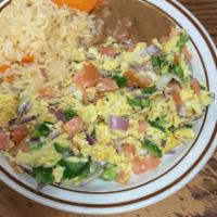 Huevos a La Mexicana · Scrambled eggs, diced tomato, jalapeno, and onions. Served with rice and beans or home potat...