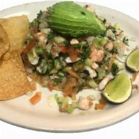 Tostada de ceviche  · Cook shrimp with tomatoes , onions , cilantro , cucumber , lime juice and avocado .
