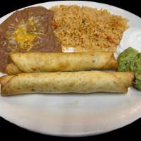 Flautas combo  · Two fried flour tortillas with cheese and sh . beef Or sh . Chicken served with rice and bea...