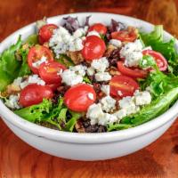 Whisk House Salad · Candied walnuts, gorgonzola, grape tomatoes, raisins and cider vinaigrette. Gluten free.

