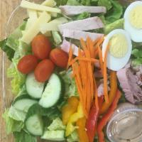 Chef Salad - Pita Bread  · Romaine lettuce, tomato, cucumber, ham, turkey, swiss cheese, hard boiled egg & dijon vinaig...