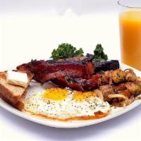 Breakfast Plate · Two cage free eggs, choice of breakfast meat, and home fries served with your choice of bread.