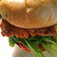 Crispy Chicken Sandwich · Crispy Buttermilk Fried Chicken, lettuce, tomato, pickles, and our house-made sauce, served ...