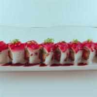 T and T Roll · In: spicy tuna, cucumber and avocado. Top: tuna and green onion. Comes with eel sauce.