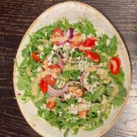 Tavern Arugula Salad · Shropshire blue, toasted pine nut, tomato, red onion and stone ground mustard vinaigrette.