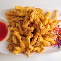 81. Shwe Myanmar Crispy Oyster Mushroom · Mushrooms lightly battered w/garlic  & ginger flavor