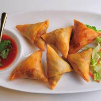 83. Samosa · Crisky pastry filled potatoes, onions & spices w/ house sauce