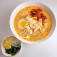 10. Shwe Myanmar Chicken Coconut Noodle Soup · Chicken and coconut milk creamy soup with flour noodles, fishcake, boiled egg and crispy egg...