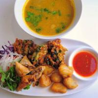 106. Vegetarian Samosa, Pakora & Onion Soup · Crispy samosa, fried pakora (light battered mixed vegetables) onion frinterested & mint leav...