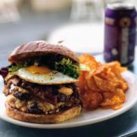 Double Stack Beef Burger · Choice of cheddar or pimento cheese, pickled mustard seeds and baby greens on a toasted sour...