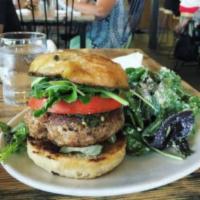Commune Burger · Burger made of field peas, potatoes, carolina gold rice, and sorghum berries with baby green...