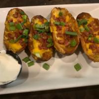 Potato Skins · Stuffed to the limit with cheddar cheese and hickory-smoked bacon. Served with a side of sou...
