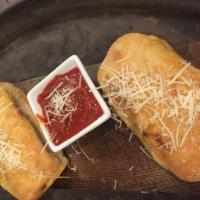 Putnam Pepperoni Rolls(2) · Pepperoni, ricotta and mozzarella cheese, a pinch of garlic salt, wrapped up and topped off ...