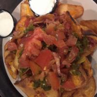 FireSide Potato Chips · Thick sliced and deep fried, topped with fresh chopped tomatoes, hickory-smoked bacon, chedd...