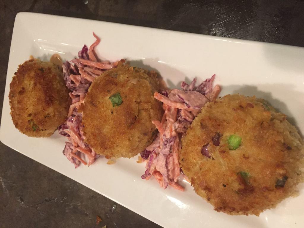Crab Cake · 3 authentic Maryland crab cakes pan-fried to perfection and served with our spicy fire sauce.