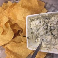 Spinach Artichoke Dip · Served with homemade tortilla chips.
