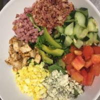 Classic Cobb Salad · Ham, grilled chicken, bacon, sliced avocado, egg slices and bleu cheese crumbles layered ove...