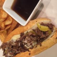 Slow Roasted Prime Rib Sandwich · Slow-roasted to perfection and topped with banana pepper, provolone and Parmesan cheese with...