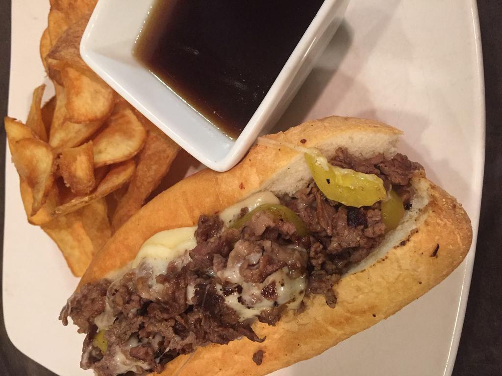 Slow Roasted Prime Rib Sandwich · Slow-roasted to perfection and topped with banana pepper, provolone and Parmesan cheese with a side of au jus. Served with FireSide thick-sliced potato chips.