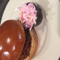 Pulled Pork Sandwich · Slow-roasted and seasoned to perfection, served with our sweet BBQ sauce and a small side of...