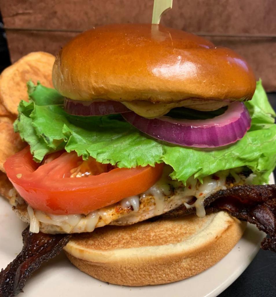 Kickin Chicken Sandwich · Your choice of fried or grilled chicken. Served with jalapeno bacon, pepper jack cheese, chipotle mayo, lettuce, tomato and onion on a brioche bun. Served with FireSide thick-sliced potato chips.