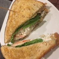 Chicken Salad Sandwich · Our homemade chicken salad on toasted wheat berry bread, served with lettuce, tomato and Swi...
