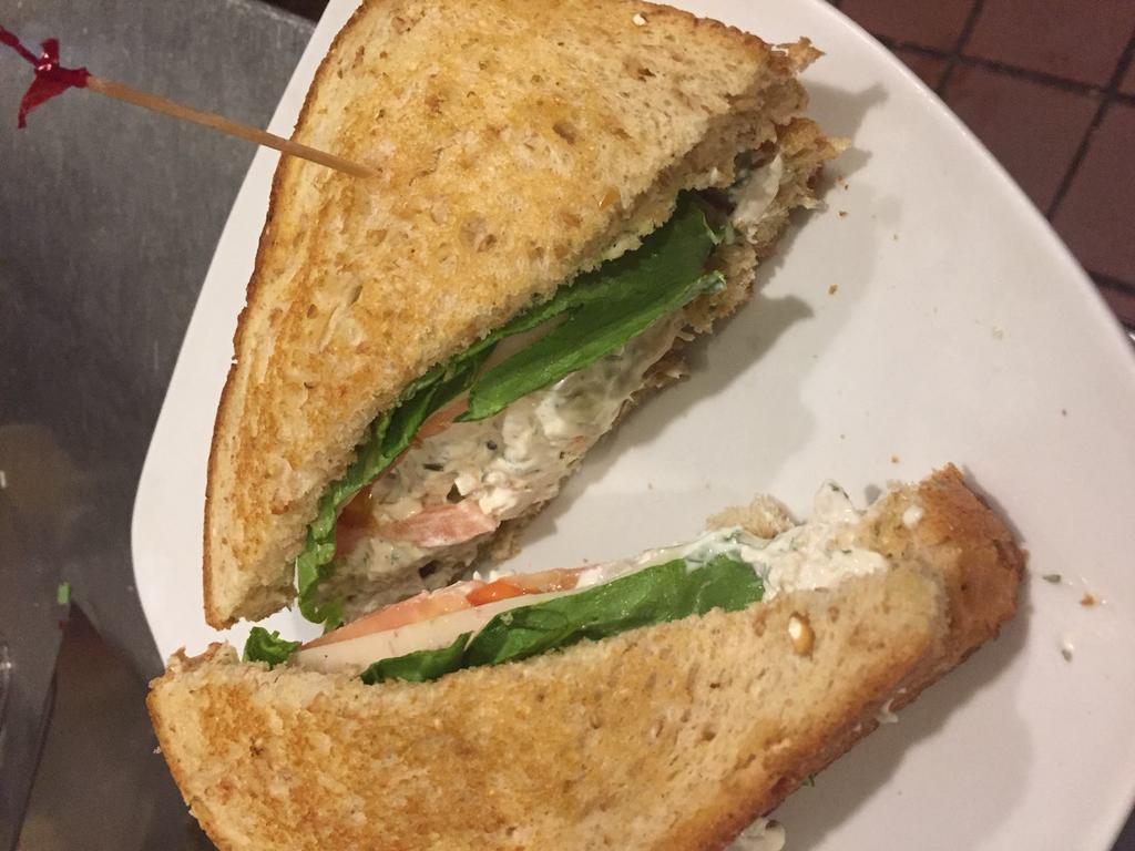 Chicken Salad Sandwich · Our homemade chicken salad on toasted wheat berry bread, served with lettuce, tomato and Swiss cheese. Served with FireSide thick-sliced potato chips.
