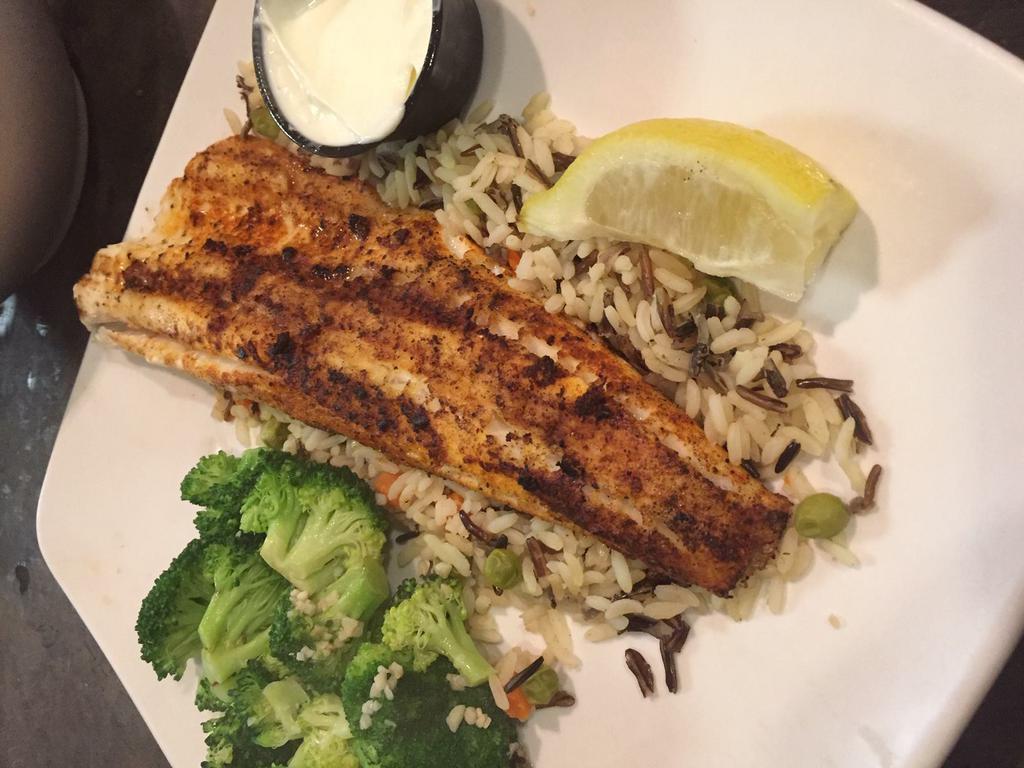 Walleye · A large grilled or fried filet served on a bed of wild grain rice and Tabasco lime sauce. Served with a salad and 1 side.